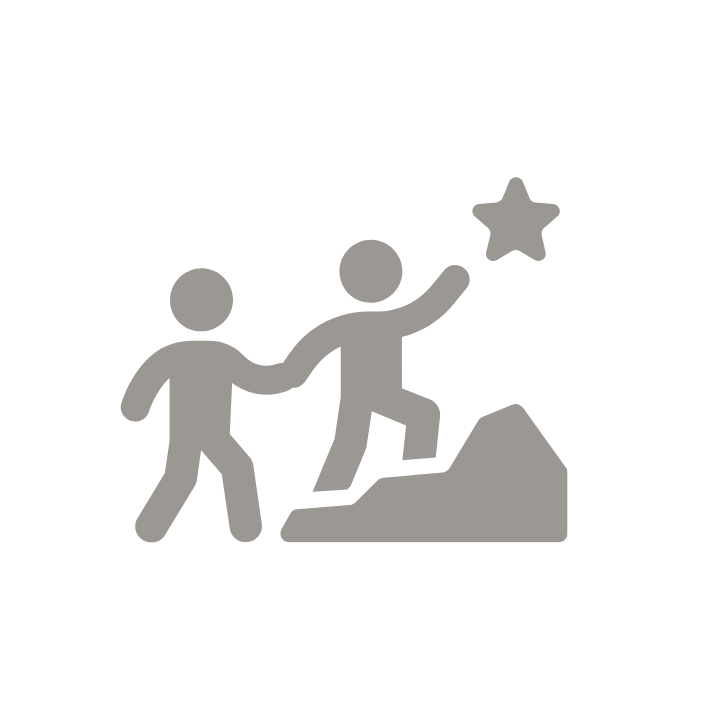Leader is helping tteam member to climb a mountain.
