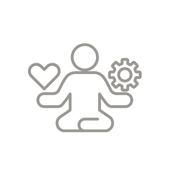 Person in meditation posture with heart and cogwheel.